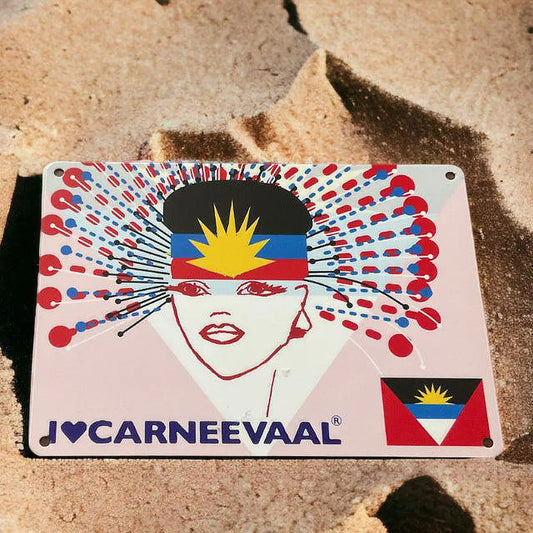 Antigua decorative carnival art sign placed on natural sand