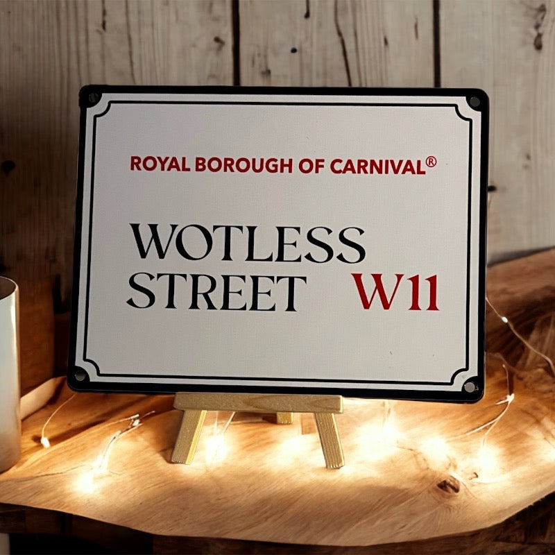 Wotless street sign on an easel against a wooden slatted wall