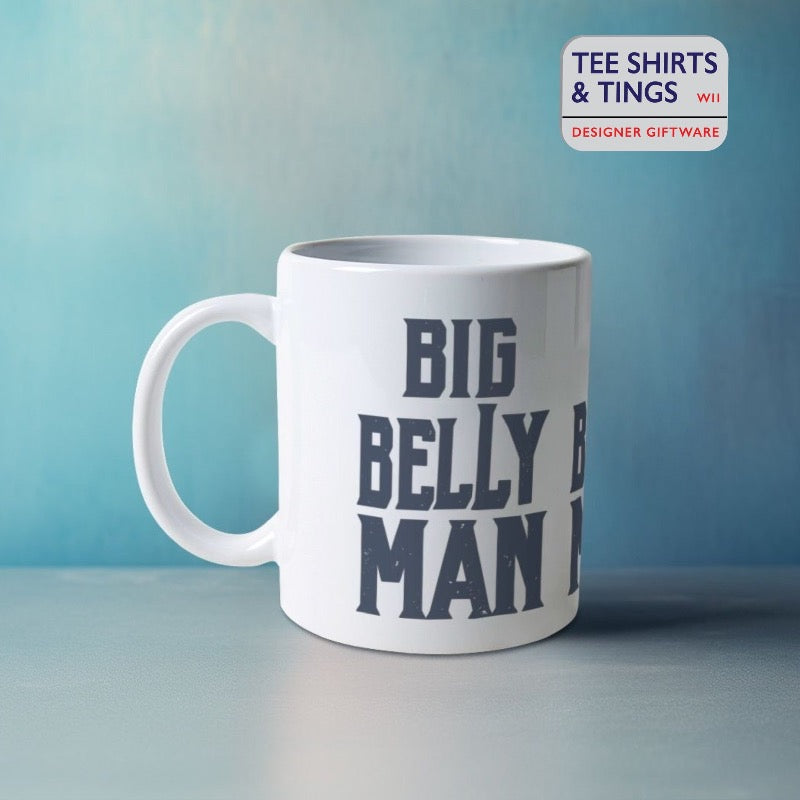 Big Belly Man mug , white mug  with bold black font set against a sea blue wall