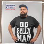 Man with a beard, wearing a blue cap and black cotton teeshirt with Big Belly Man in white on the front of the teeshirt
