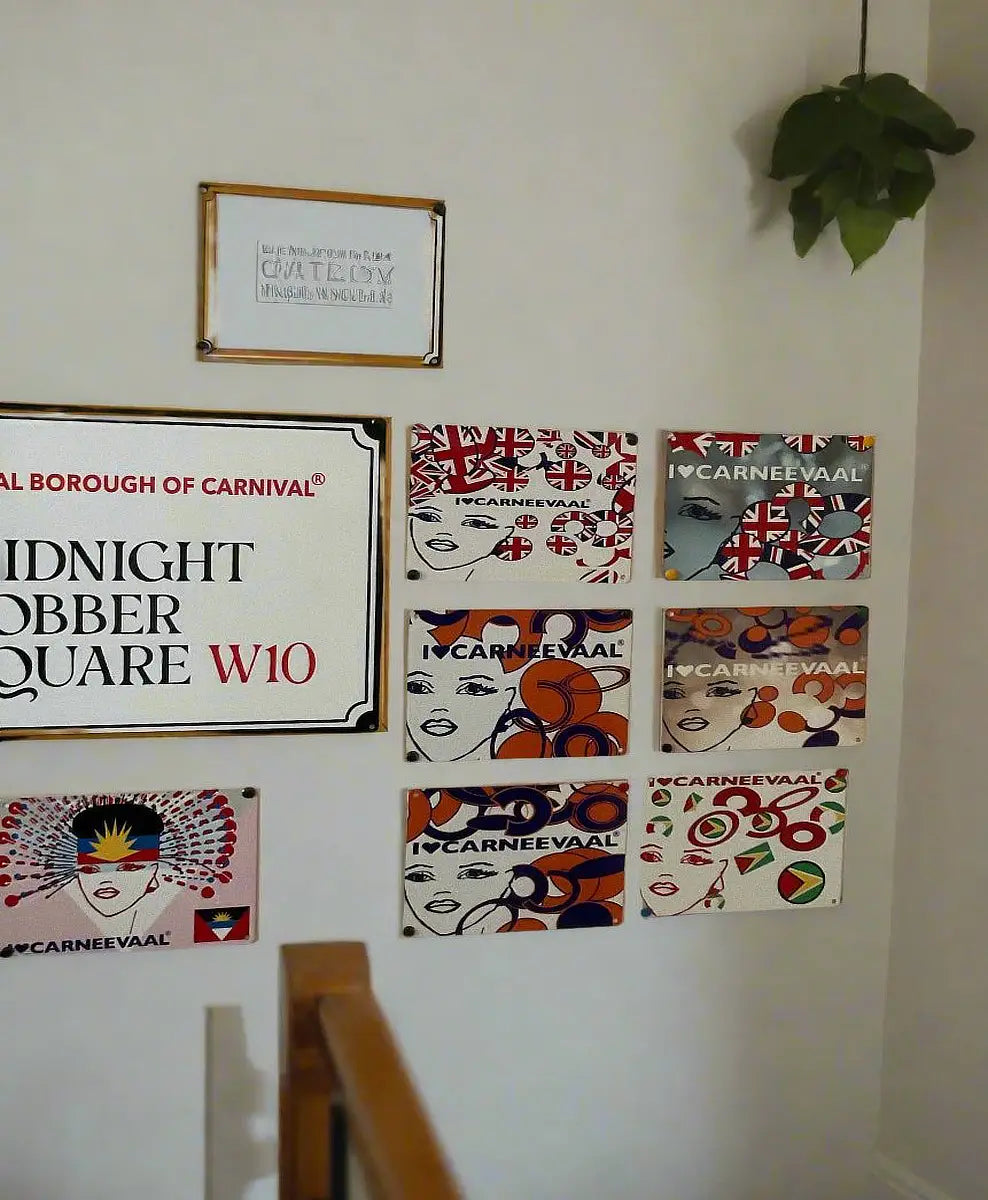 Gallery wall display featuring Royal Borough of Carnival street signs and decorative carnival mini art plaques⁠