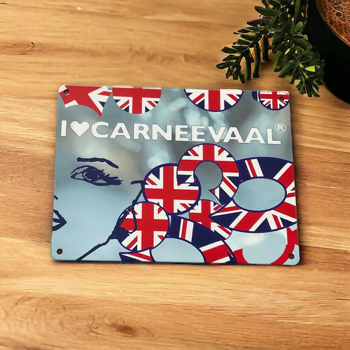 Angled view of the Lilly Cobalt Blue decorative carnival art sign with Union Jack graphic detailing on natural wood