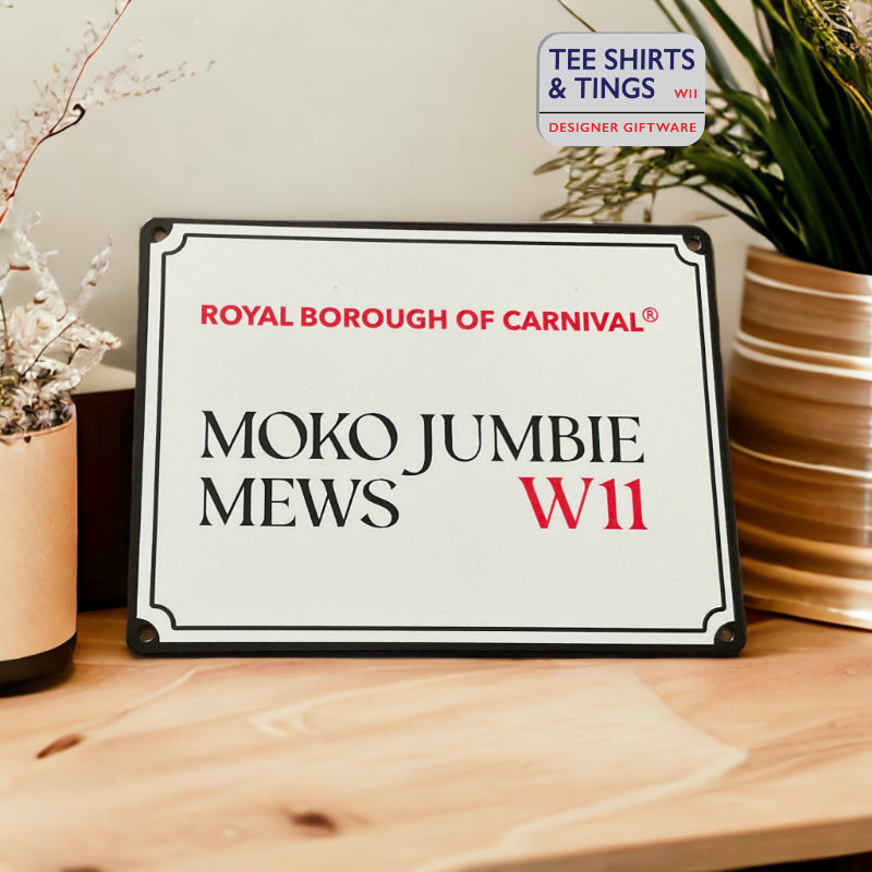 Moko Jumbie Mini Metal street sign on a light coloured work surface