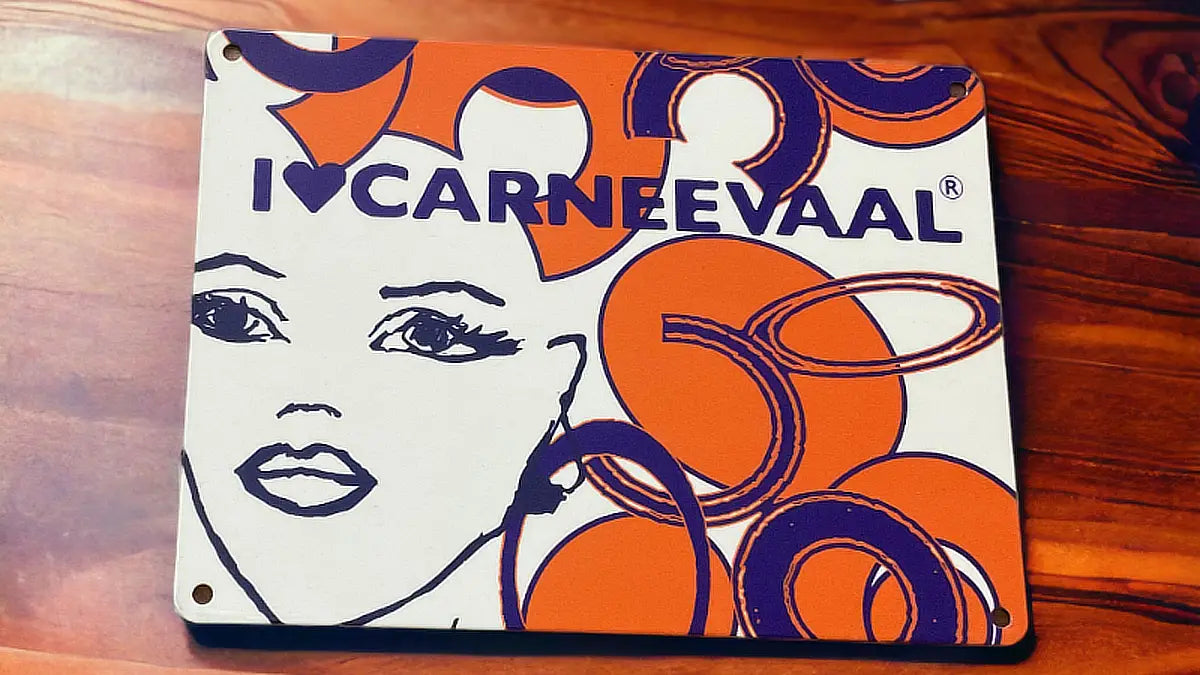 Tangerine blue decorative carnival art sign styled flat on a dark wooden surface