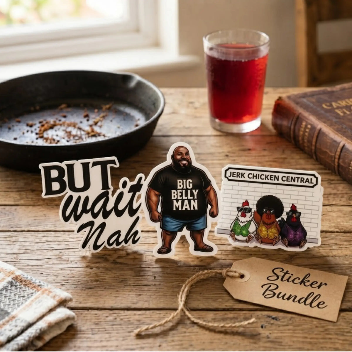 Sticker set  featuring But Wait Nah, Big Belly Man, and Jerk Chicken Central die-cut designs alongside a Kraft paper bundle tag, styled on a rustic wooden table with a cast-iron skillet and sorrel drink.