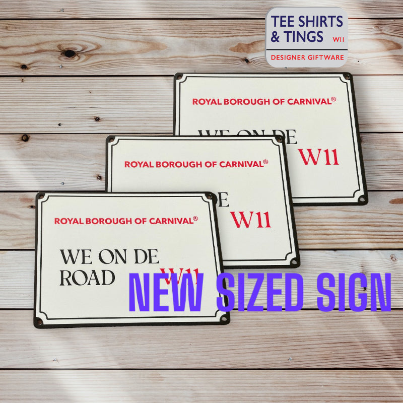 We On De Road new sized sign on wooden surface