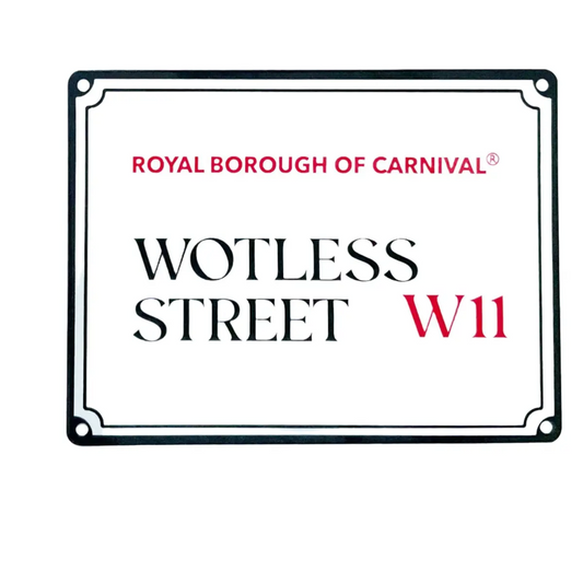 Wotless Street W11 Royal Borough of Carnival decorative mini street sign isolated on a crisp white background