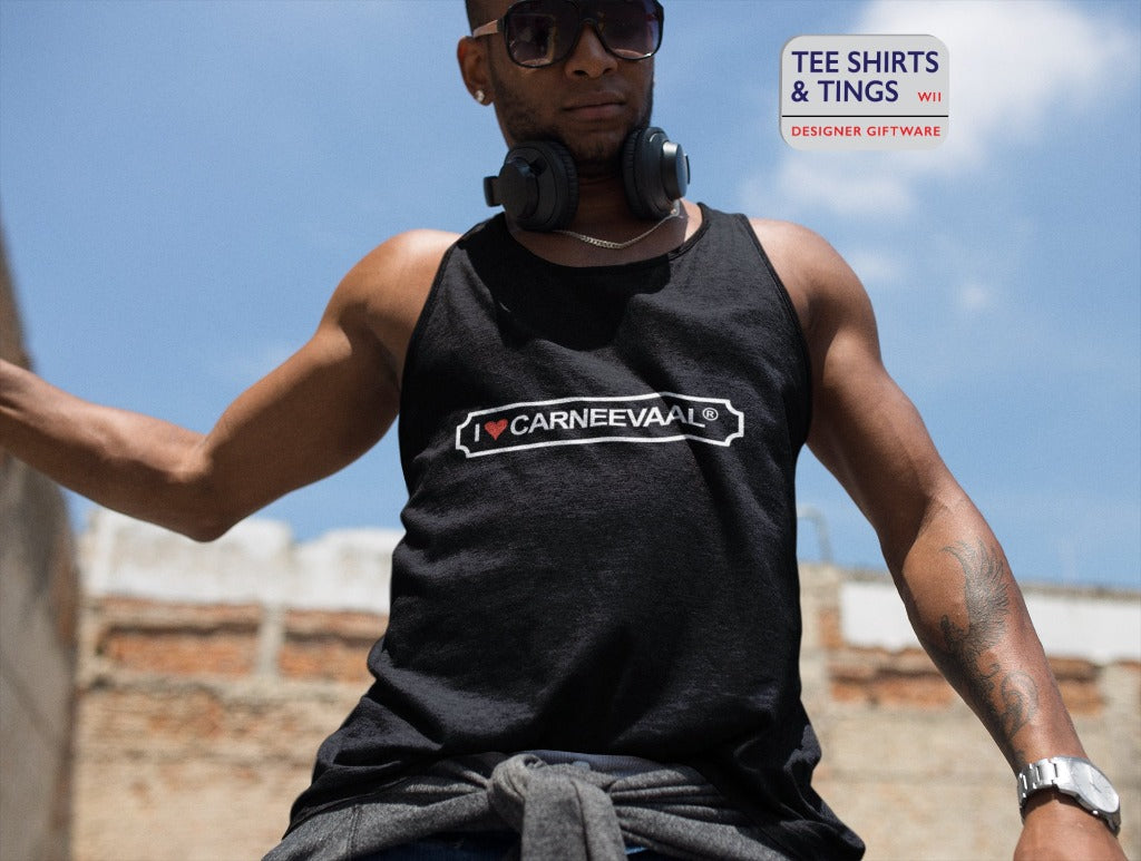 Man outside on a sunny day wearing a 100% black organic cotton Vest Tank Top with I ❤️ CARNEEVAAL®️ printed on the front.