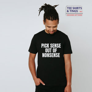 Man wearing a black organic tee shirt with white writing on the front which reads Pick Sense Out Of Nonsense