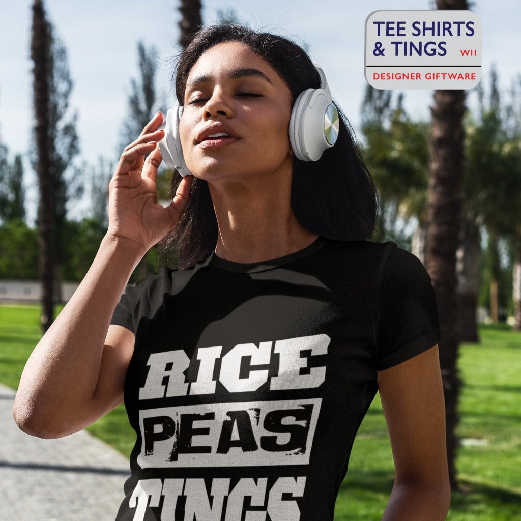 Lady wearing a black organic cotton teeshirt ft Rice, Peas, Tings and listening to music on her headphones
