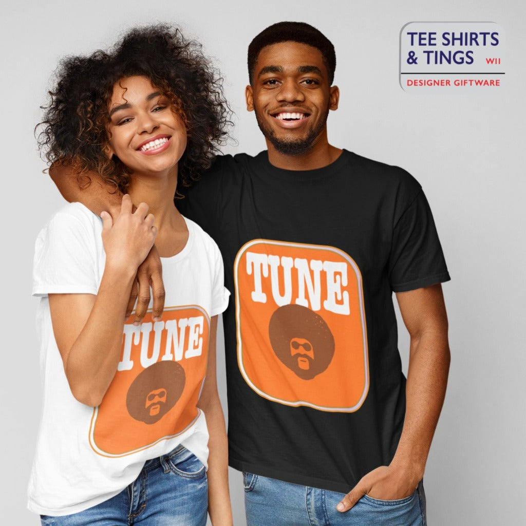 Young lady wearing a scoop-neck 100% organic white cotton tee with an orange rectangle with the wording TUNE alongside a man wearing a black organic teeshirt with the same design.
